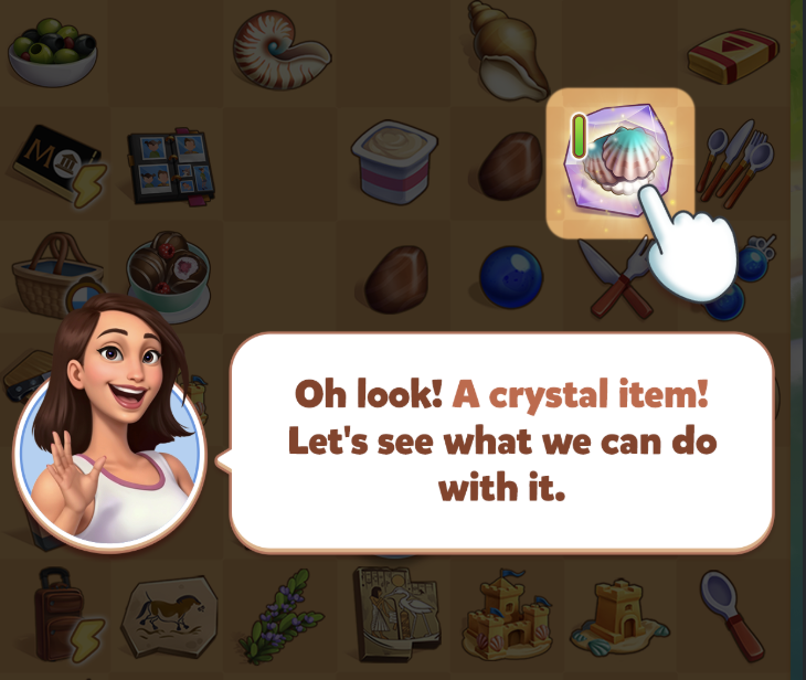 Crystal Item tutorial with a hand icon pointing to a shell inside a purple crystal on the game board.png
